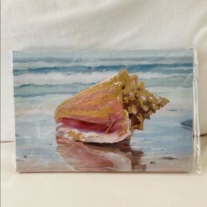 Sea shell washed up on the
beach with gold foil detail
canvas wall art